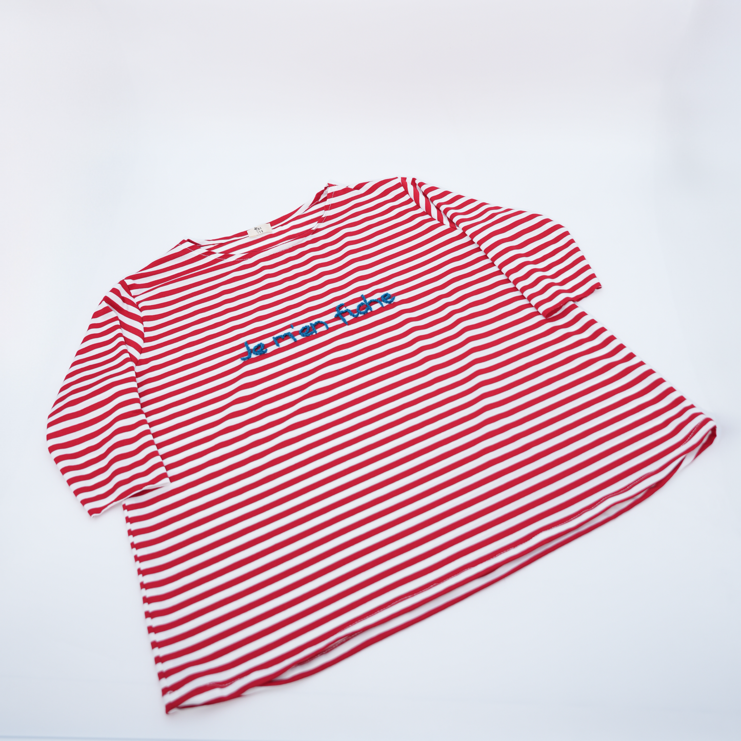T-Shirt manica lunga a righe bianche e rosse "Je m'en fiche"